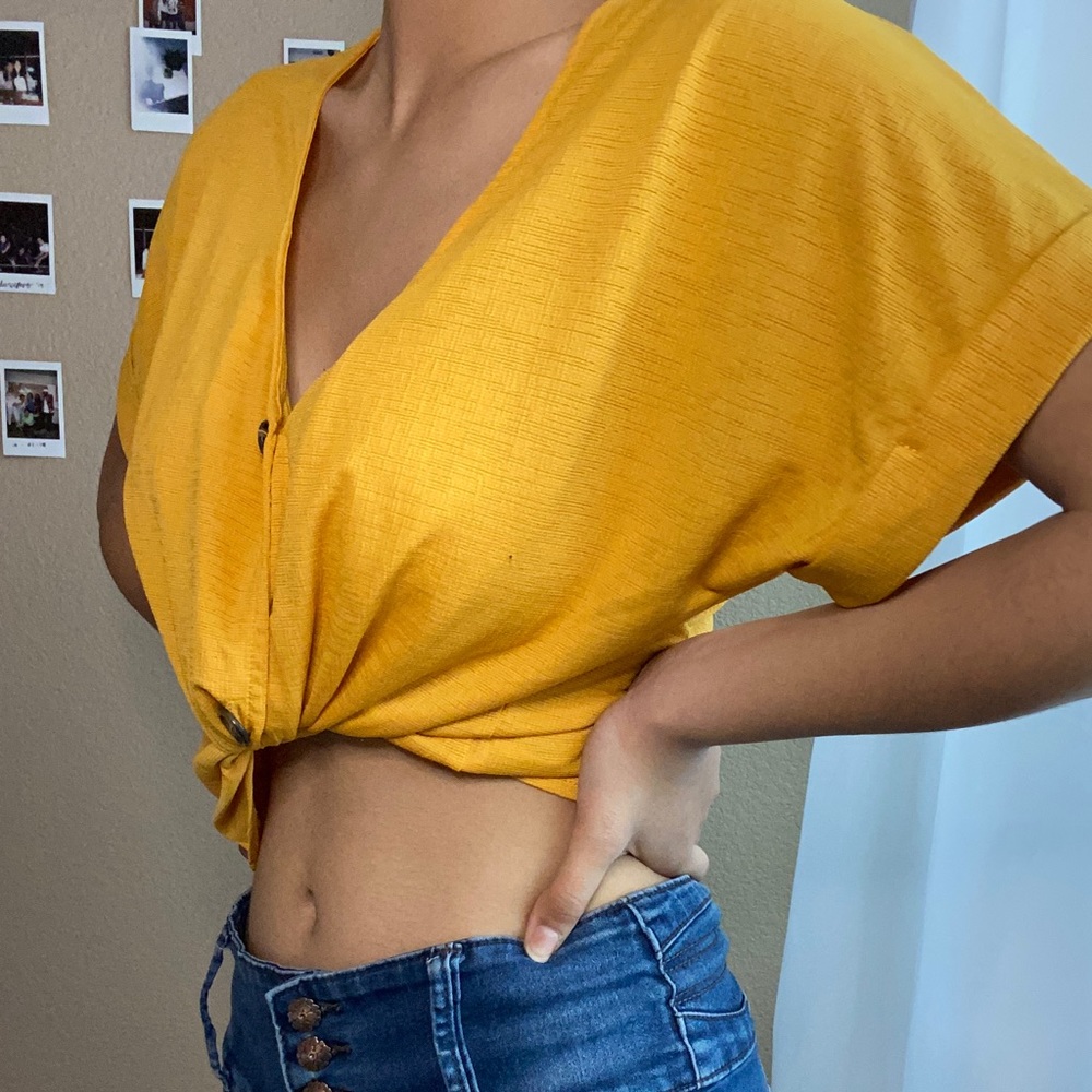 Yellow button-up top